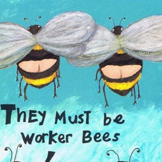 Two bees are hanging upside down on a wall.